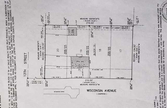 a white house with wooden fence