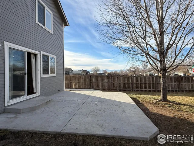 a swimming pool with wooden fence
