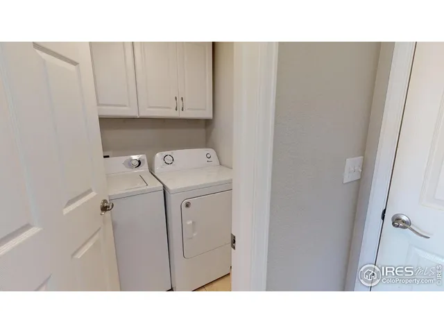 a open kitchen with a sink and cabinets