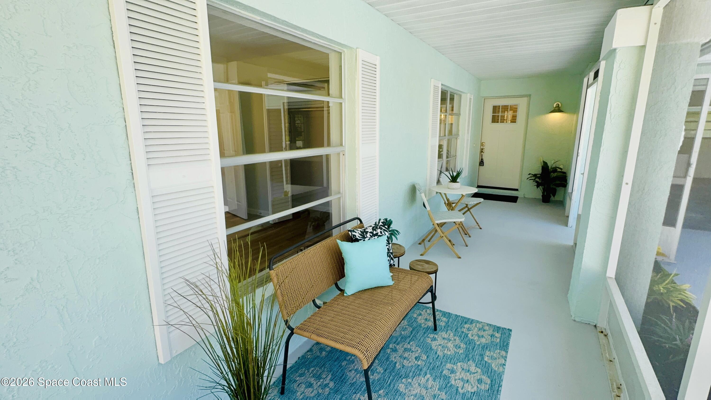 1910 Tallridge Road Melbourne, FL 32935 - Photo 3 of 34 front porch with door