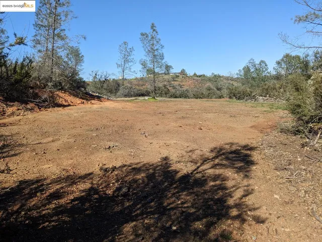 a view of mountain view with trees
