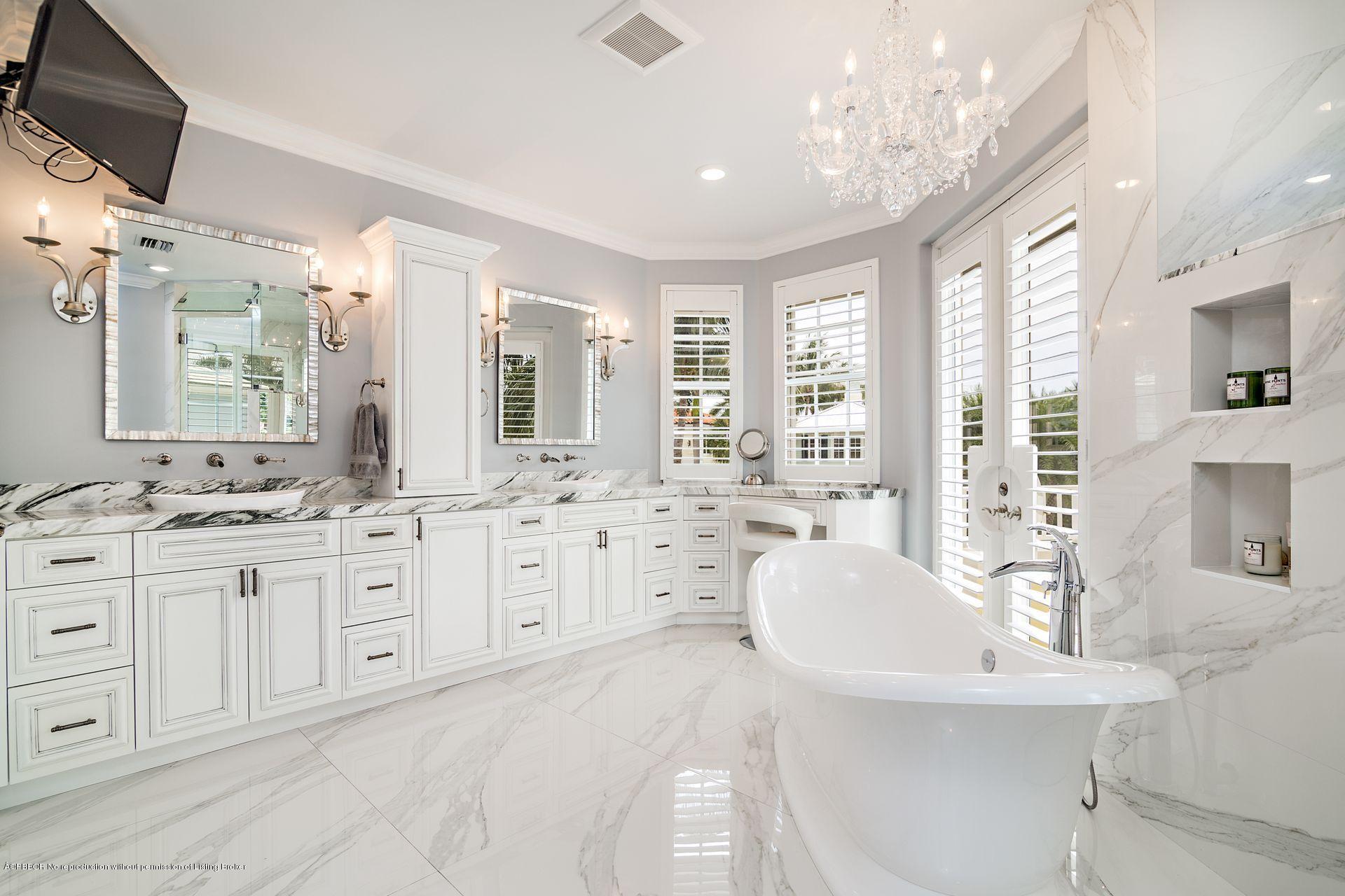 1121 Marble Way Boca Raton, FL 33432 - Photo 26 of 44 a spacious bathroom with sinks mirror and a bathtub