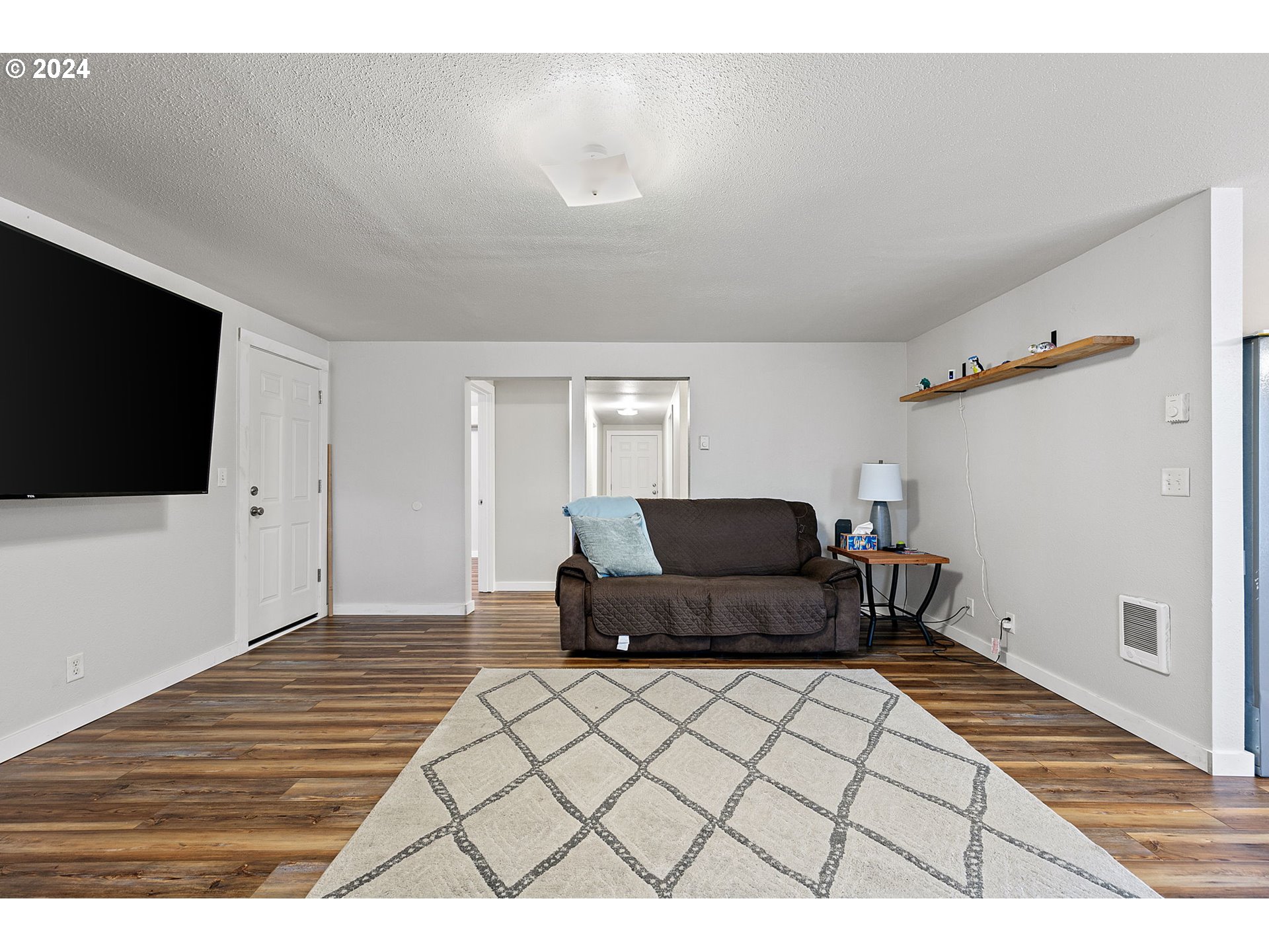 183 35th Street Springfield, OR 97478 - Photo 7 of 36 a living room with furniture and a flat screen tv