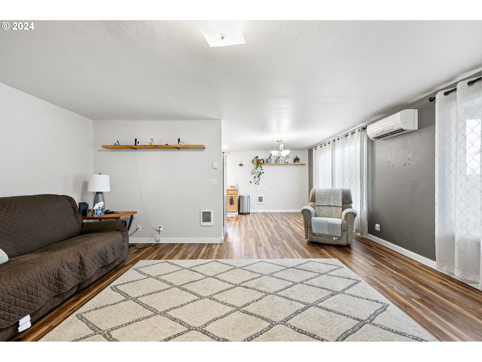 183 35th Street Springfield, OR 97478 - Photo 10 of 36 a living room with furniture and a rug