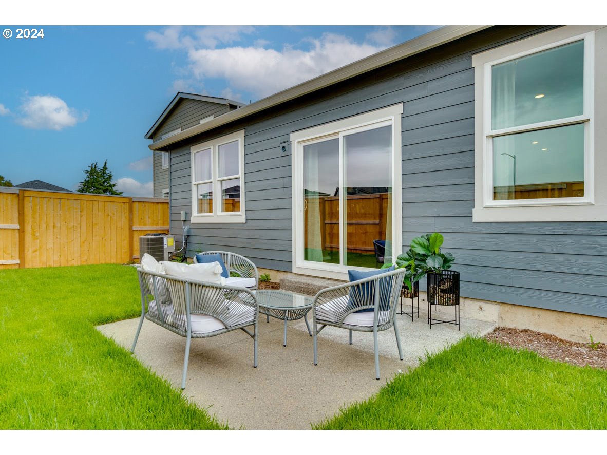 2768 U Street Springfield, OR 97477 - Photo 23 of 24 a view of an house with backyard and sitting area