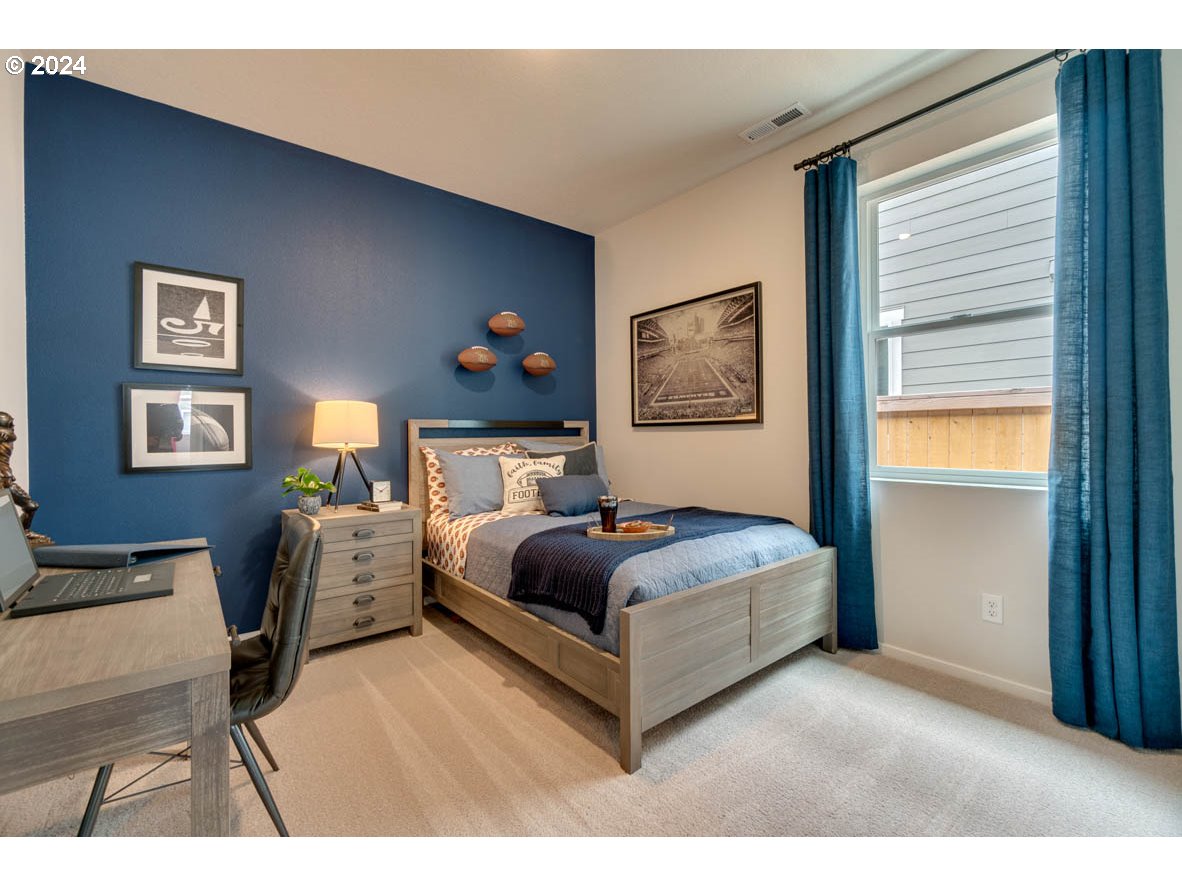 2768 U Street Springfield, OR 97477 - Photo 7 of 24 a bedroom with a bed and window