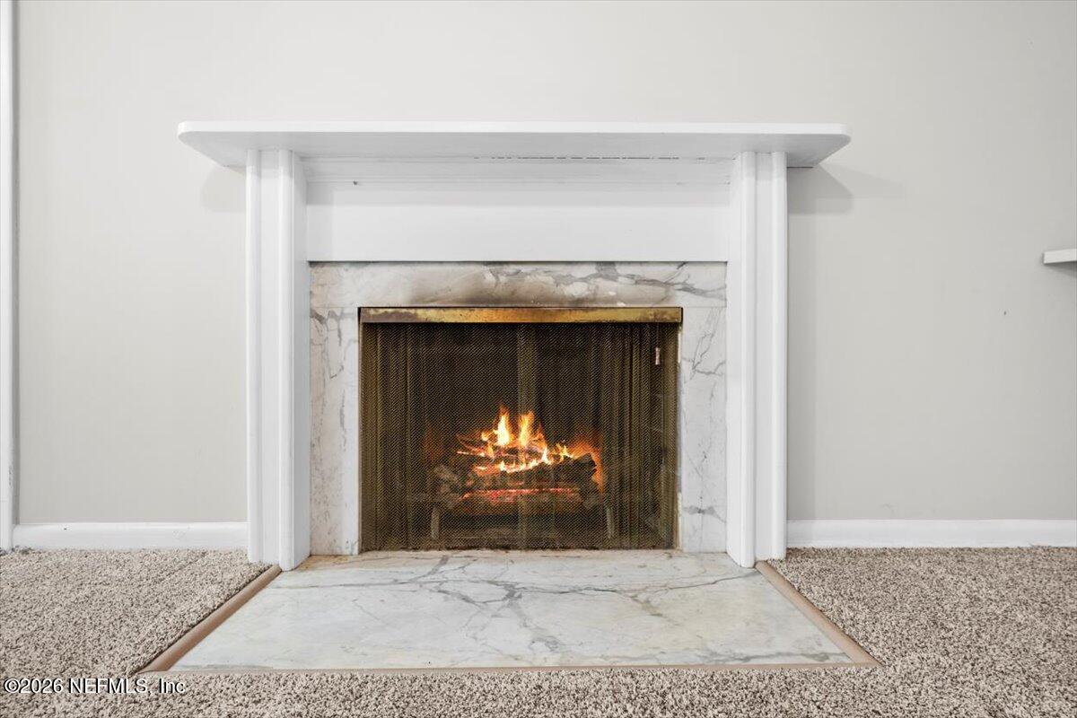 5376 Sanders Road Jacksonville, FL 32277 - Photo 12 of 44 a living room with a fireplace