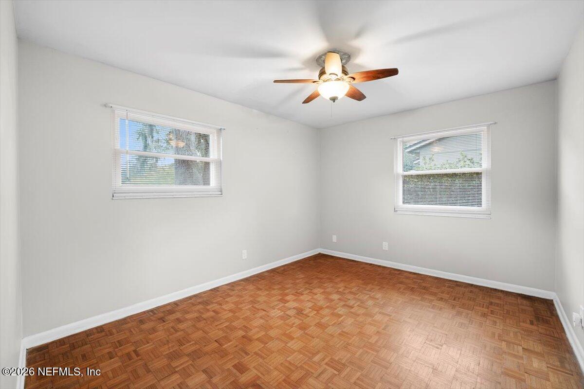 5376 Sanders Road Jacksonville, FL 32277 - Photo 22 of 44 a view of an empty room with a window
