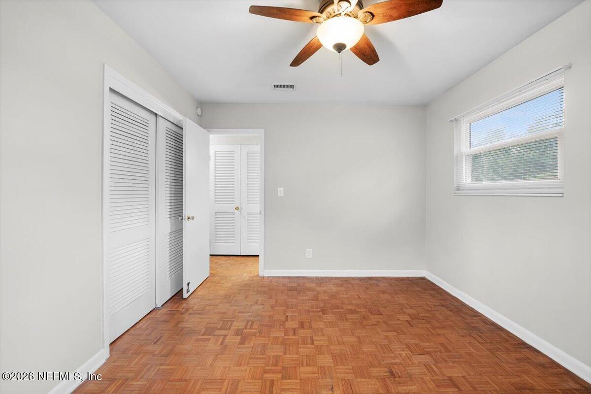5376 Sanders Road Jacksonville, FL 32277 - Photo 23 of 44 a view of an empty room with a window