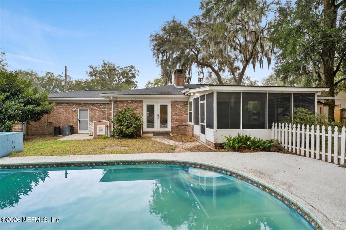5376 Sanders Road Jacksonville, FL 32277 - Photo 27 of 44 a front view of a house with a yard patio and swimming pool