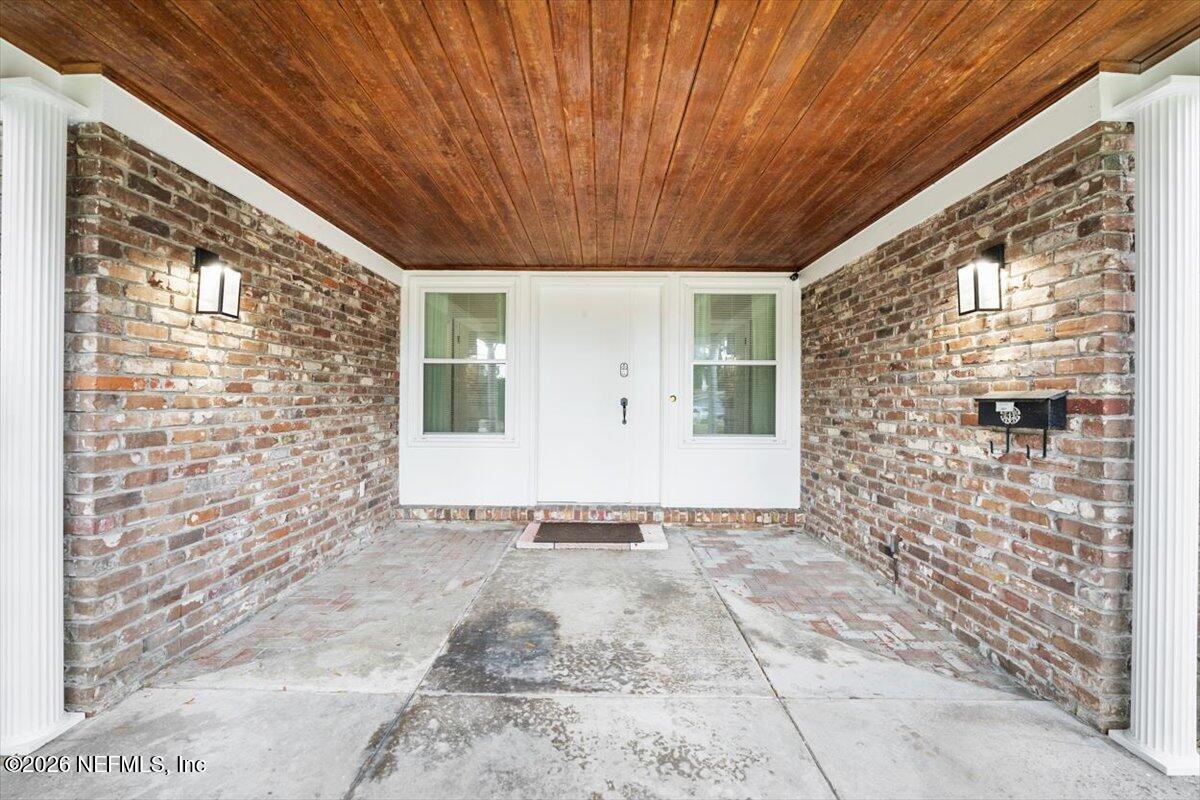 5376 Sanders Road Jacksonville, FL 32277 - Photo 3 of 44 a view of a big room with windows