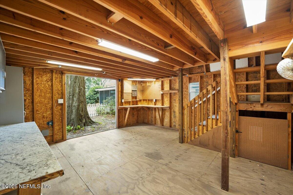 5376 Sanders Road Jacksonville, FL 32277 - Photo 35 of 44 a view of a hallway with wooden floor