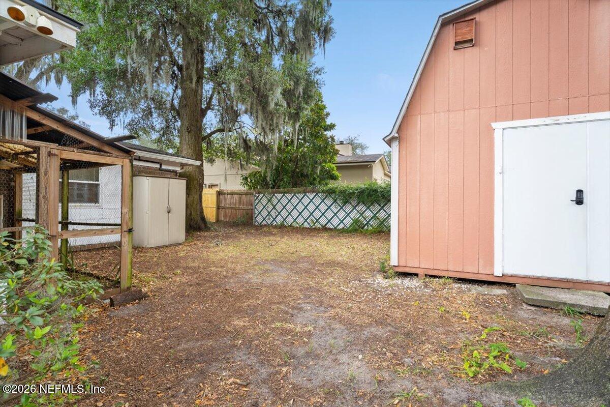 5376 Sanders Road Jacksonville, FL 32277 - Photo 38 of 44 a view of a house with a yard