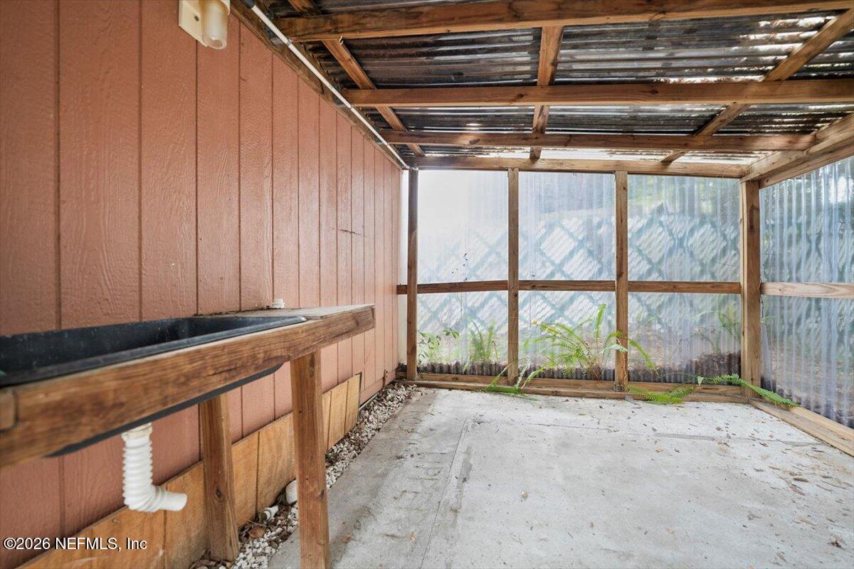 5376 Sanders Road Jacksonville, FL 32277 - Photo 39 of 44 a view of an empty room with a window