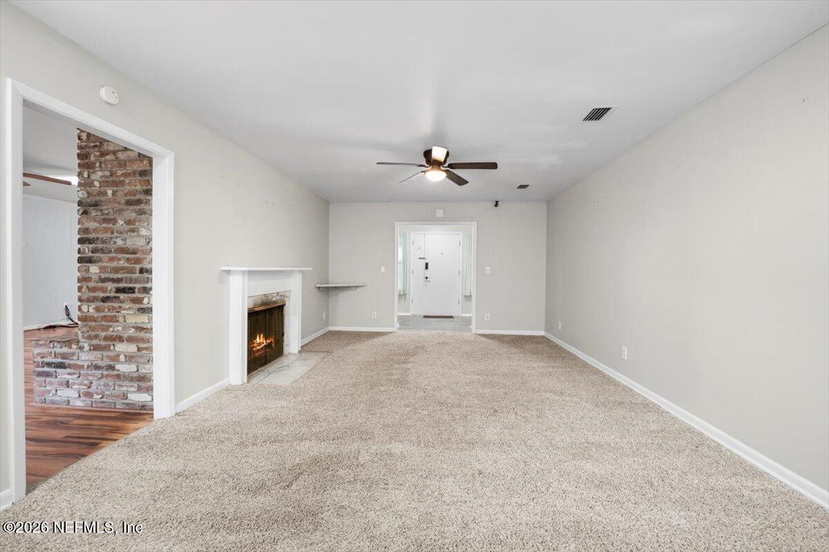 5376 Sanders Road Jacksonville, FL 32277 - Photo 10 of 44 a view of empty room with fan