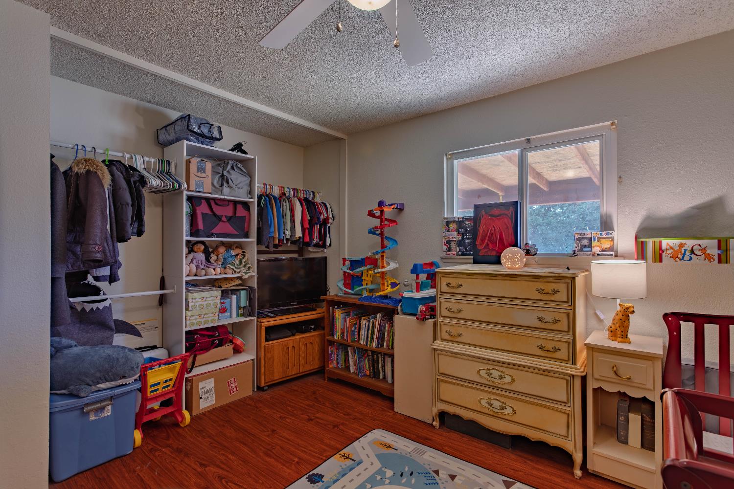 2322 Foust Street Marysville, CA 95901 - Photo 14 of 26 a bed room with a bed and a book shelf