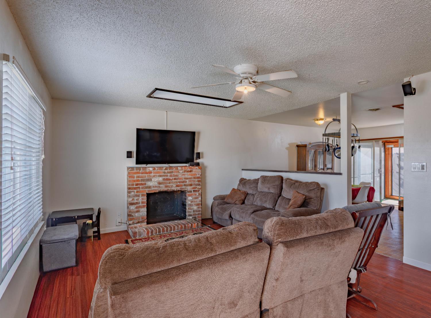 2322 Foust Street Marysville, CA 95901 - Photo 6 of 26 a living room with furniture and a fireplace