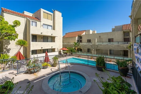 a view of a swimming pool with a patio