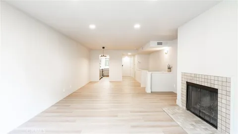 a view of a living room with a fireplace