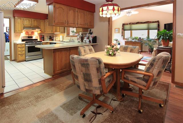12020 Murphy Road Elbert, CO 80106 - Photo 13 of 39 The Dining area off the Kitchen leads to the Family room.