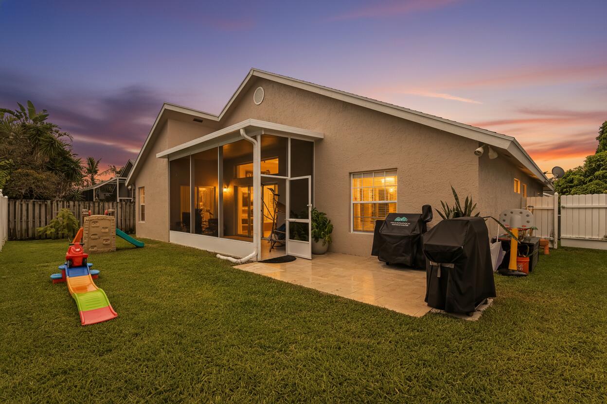 6319 Foster Street Jupiter, FL 33458 - Photo 2 of 24 33 Backyard 02_TW