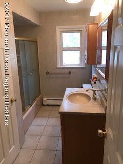 7 Pearl Drive Howell, NJ 07731 - Photo 8 of 13 a bathroom with a sink toilet and shower