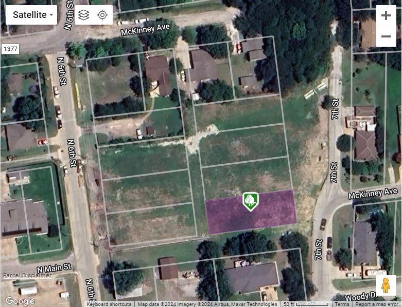 an aerial view of houses with street