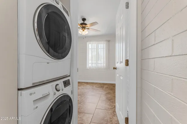 a view of a storage & utility room with a washer dryer