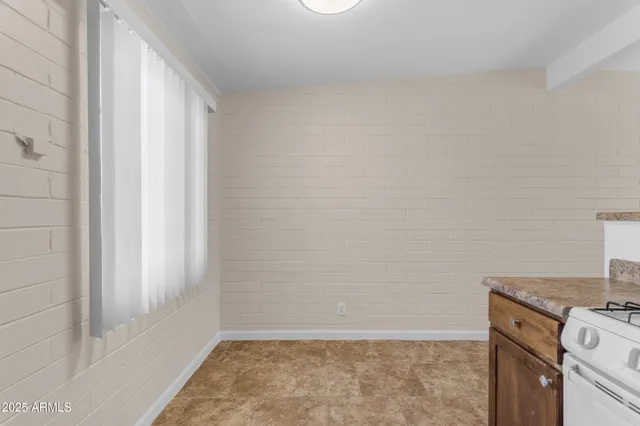 a view of a storage & utility room with a window