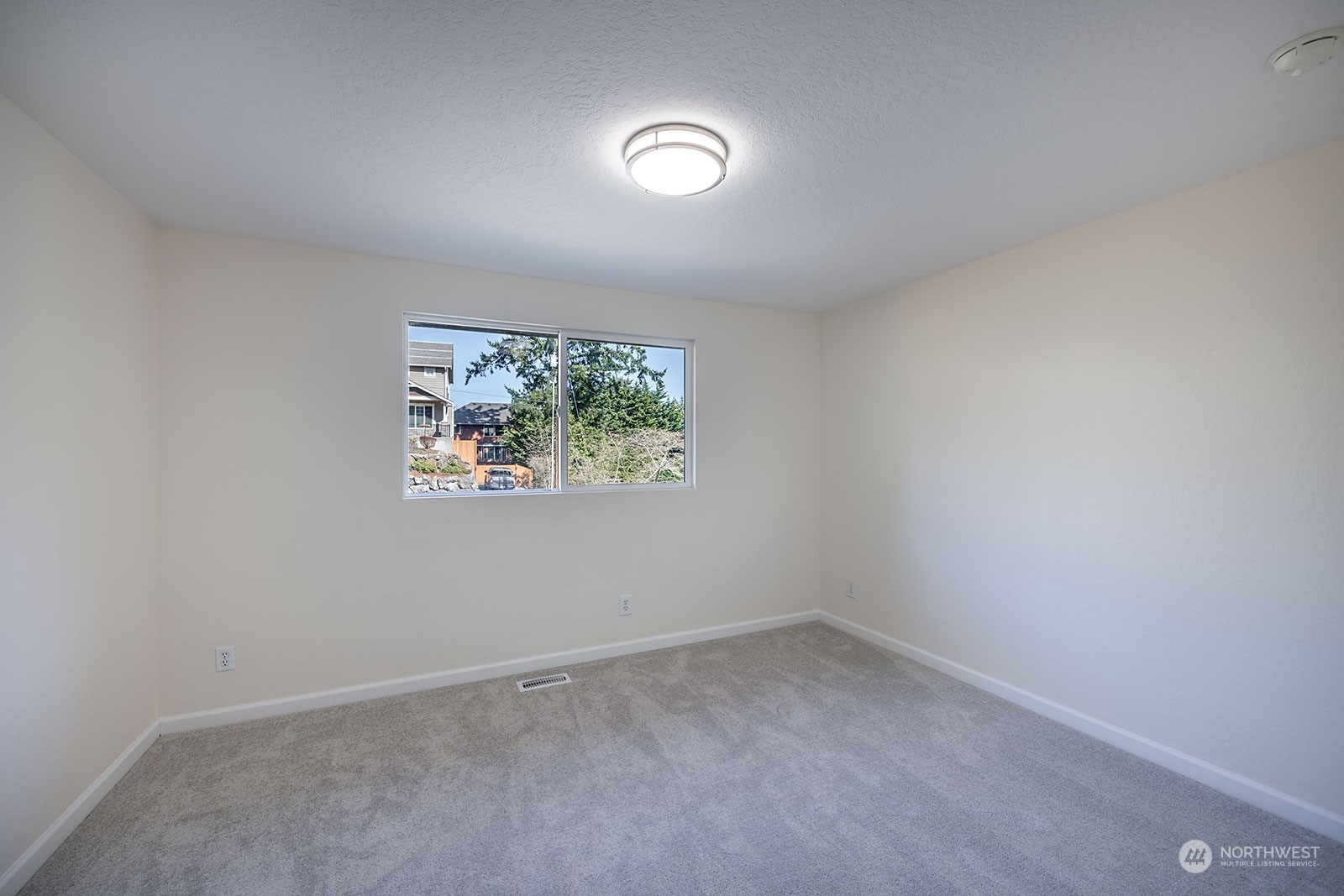 2116 242nd Street Southwest Bothell, WA 98021 - Photo 27 of 38 an empty room with a window