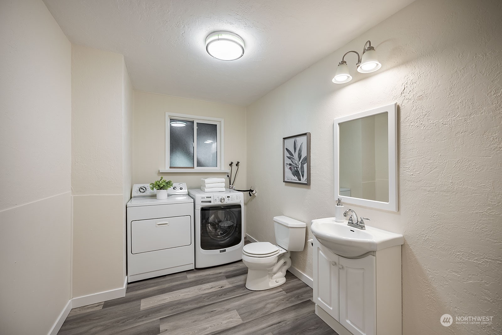 2116 242nd Street Southwest Bothell, WA 98021 - Photo 29 of 38 a bathroom with a sink toilet and mirror