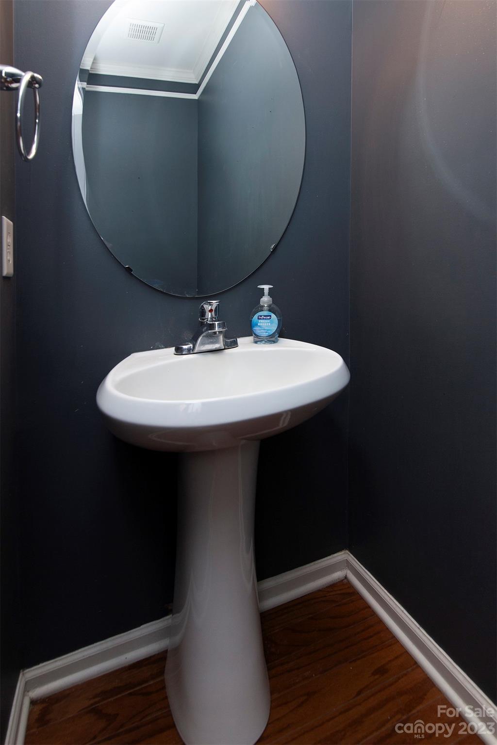 9629 Rothman Lane Charlotte, NC 28215 - Photo 12 of 24 a bathroom with a sink toilet and mirror