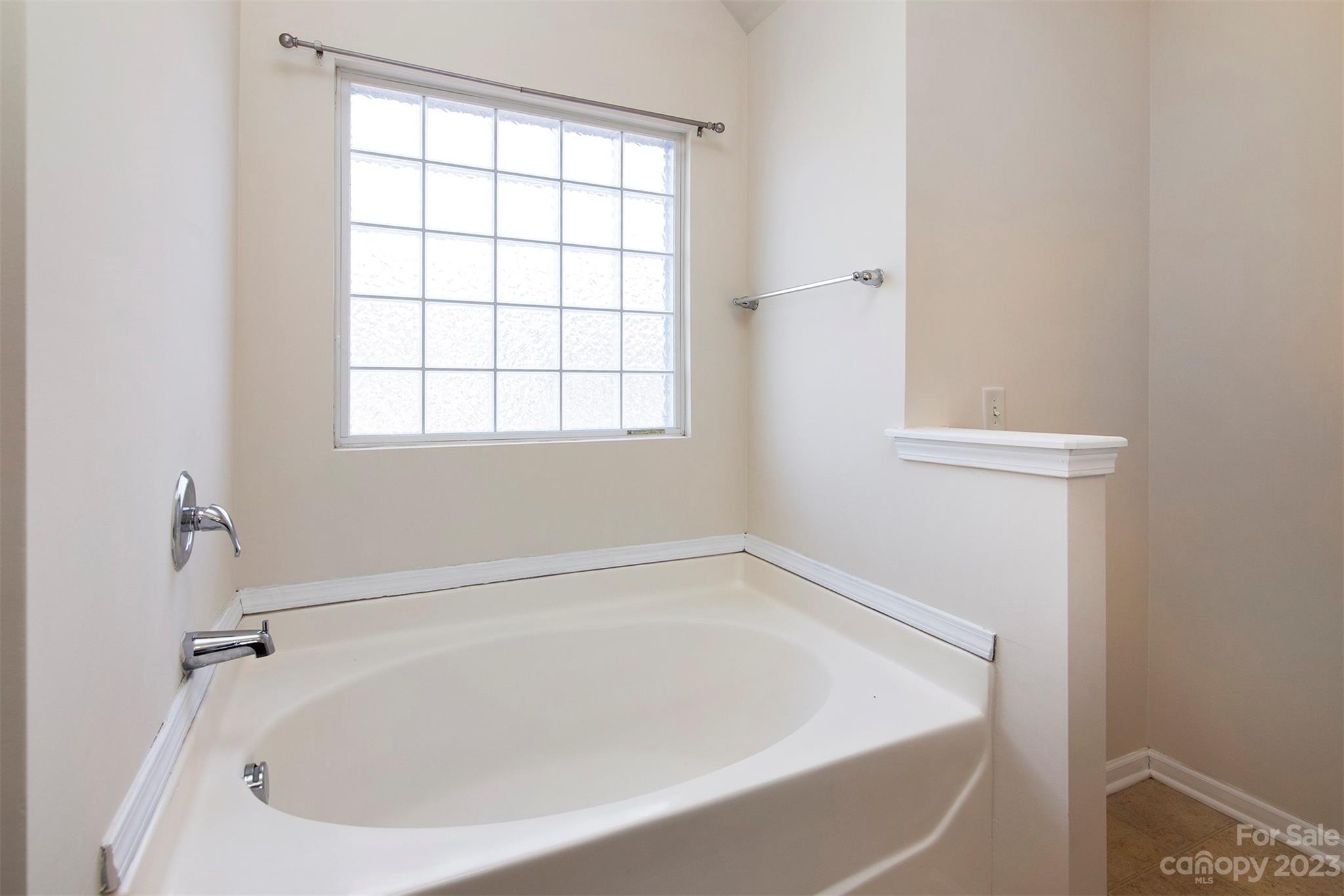 9629 Rothman Lane Charlotte, NC 28215 - Photo 15 of 24 a white bath tub sitting next to a window