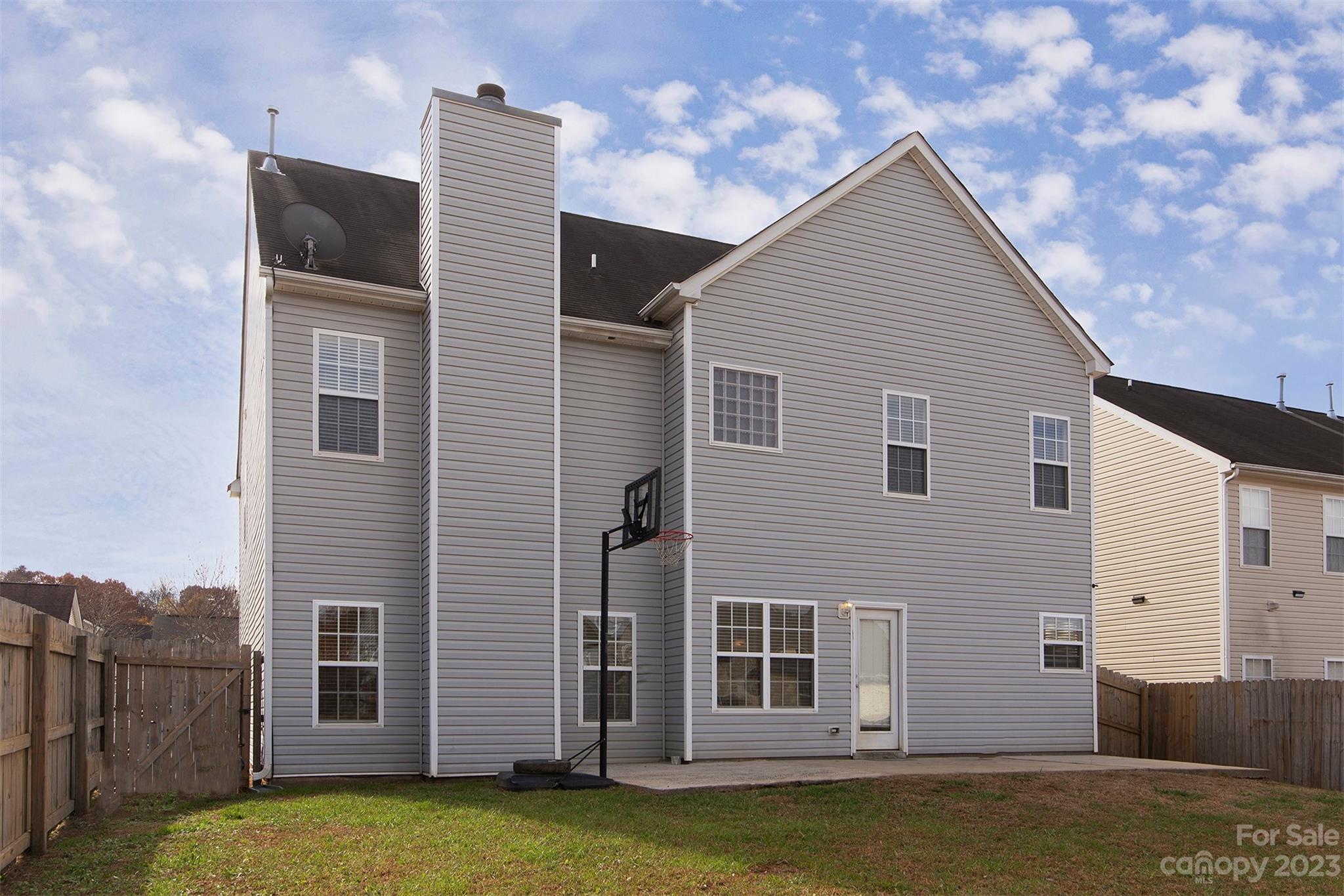 9629 Rothman Lane Charlotte, NC 28215 - Photo 22 of 24 a view of a house with backyard
