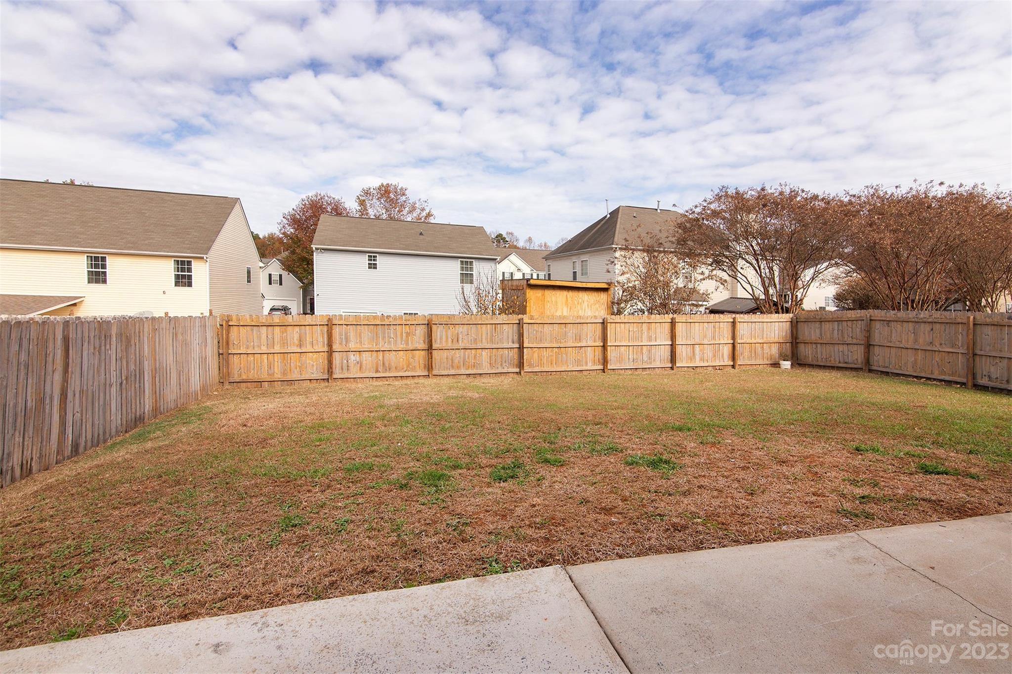9629 Rothman Lane Charlotte, NC 28215 - Photo 23 of 24 a view of backyard with large trees