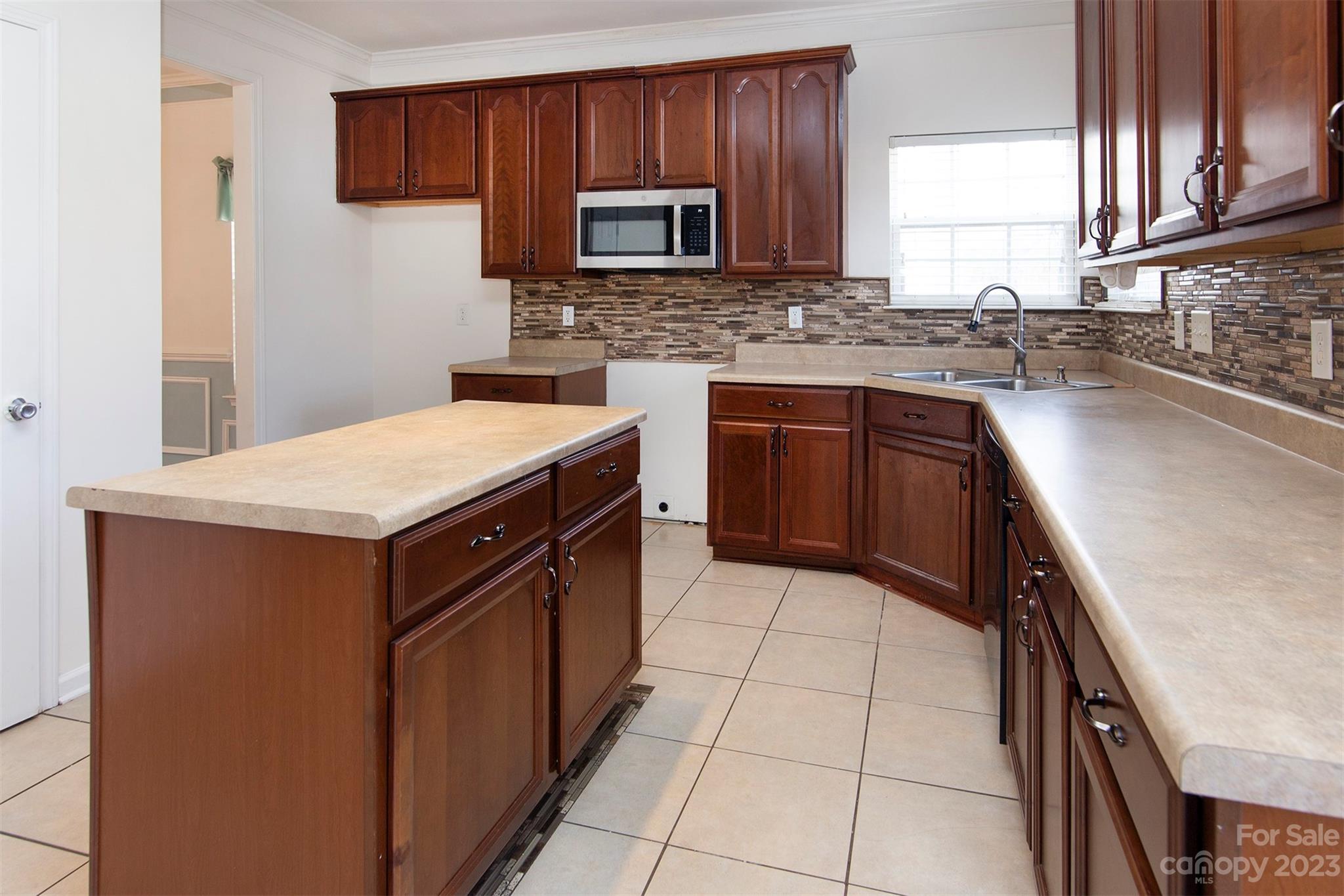 9629 Rothman Lane Charlotte, NC 28215 - Photo 8 of 24 a kitchen with a sink stove top oven and microwave