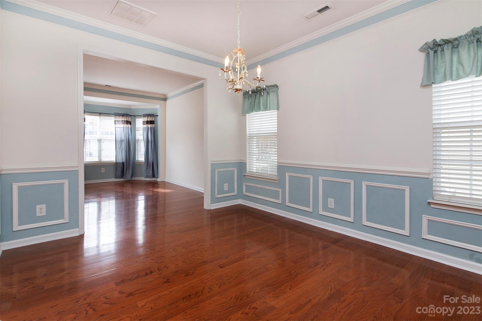 9629 Rothman Lane Charlotte, NC 28215 - Photo 10 of 24 a view of an empty room with window and wooden floor