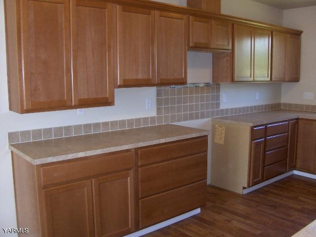 1040 Lombard Loop Road Wapato, WA 98951 - Photo 2 of 25 a kitchen with a sink cabinets and wooden floor