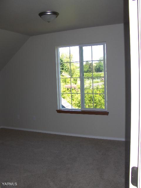 1040 Lombard Loop Road Wapato, WA 98951 - Photo 17 of 25 a view of a livingroom with an empty space and a window