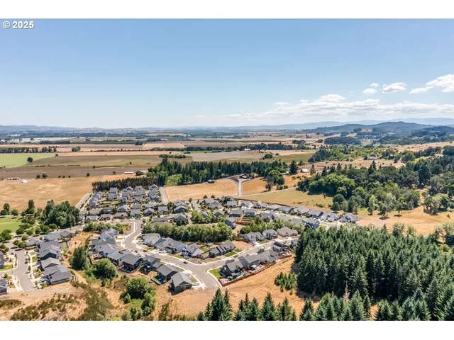 an aerial view of residential building and parking space