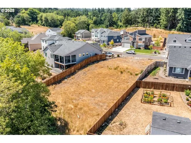 an aerial view of a house with a ocean view