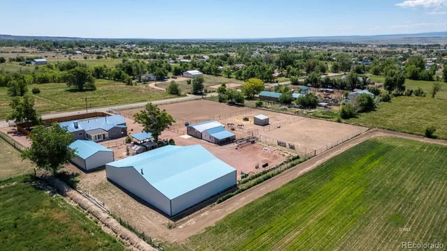 a view of a terrace with yard and mountain view in back