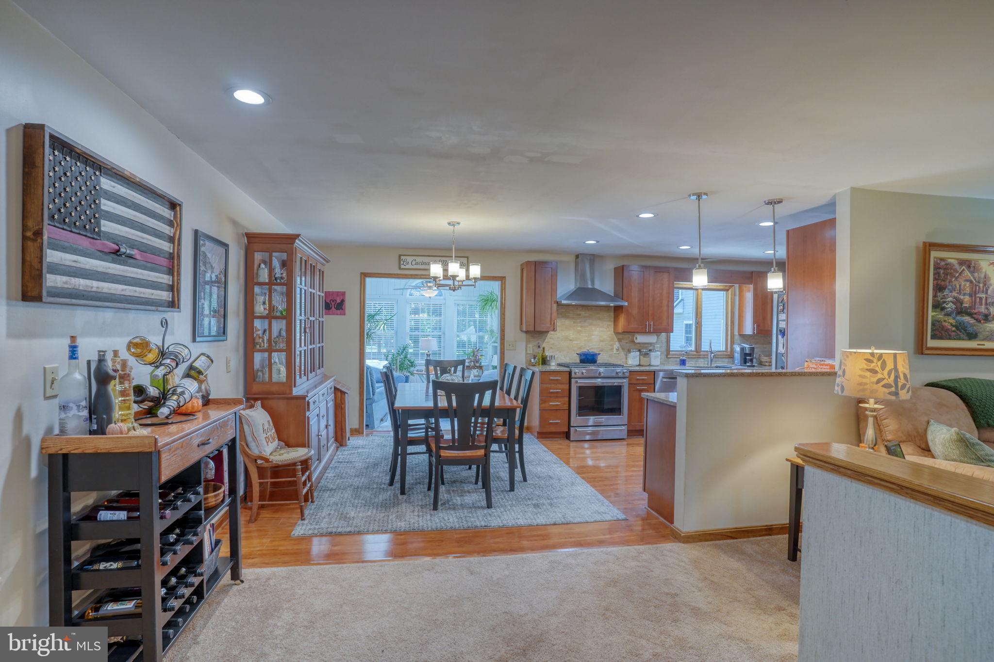 6420 Pearsons Corner Road Dover, DE 19904 - Photo 11 of 54 a living room with fireplace furniture and a flat screen tv
