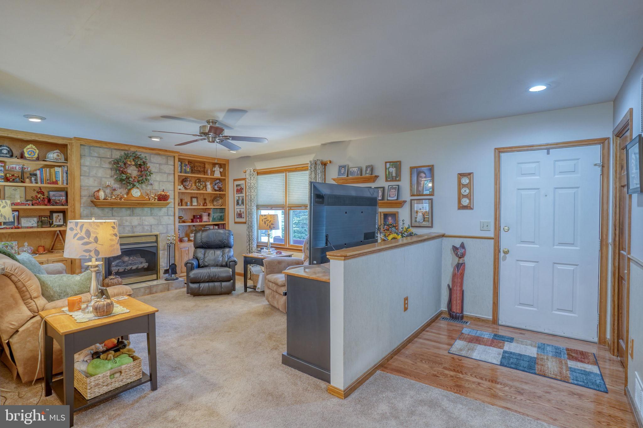 6420 Pearsons Corner Road Dover, DE 19904 - Photo 12 of 54 a room with furniture and a flat screen tv