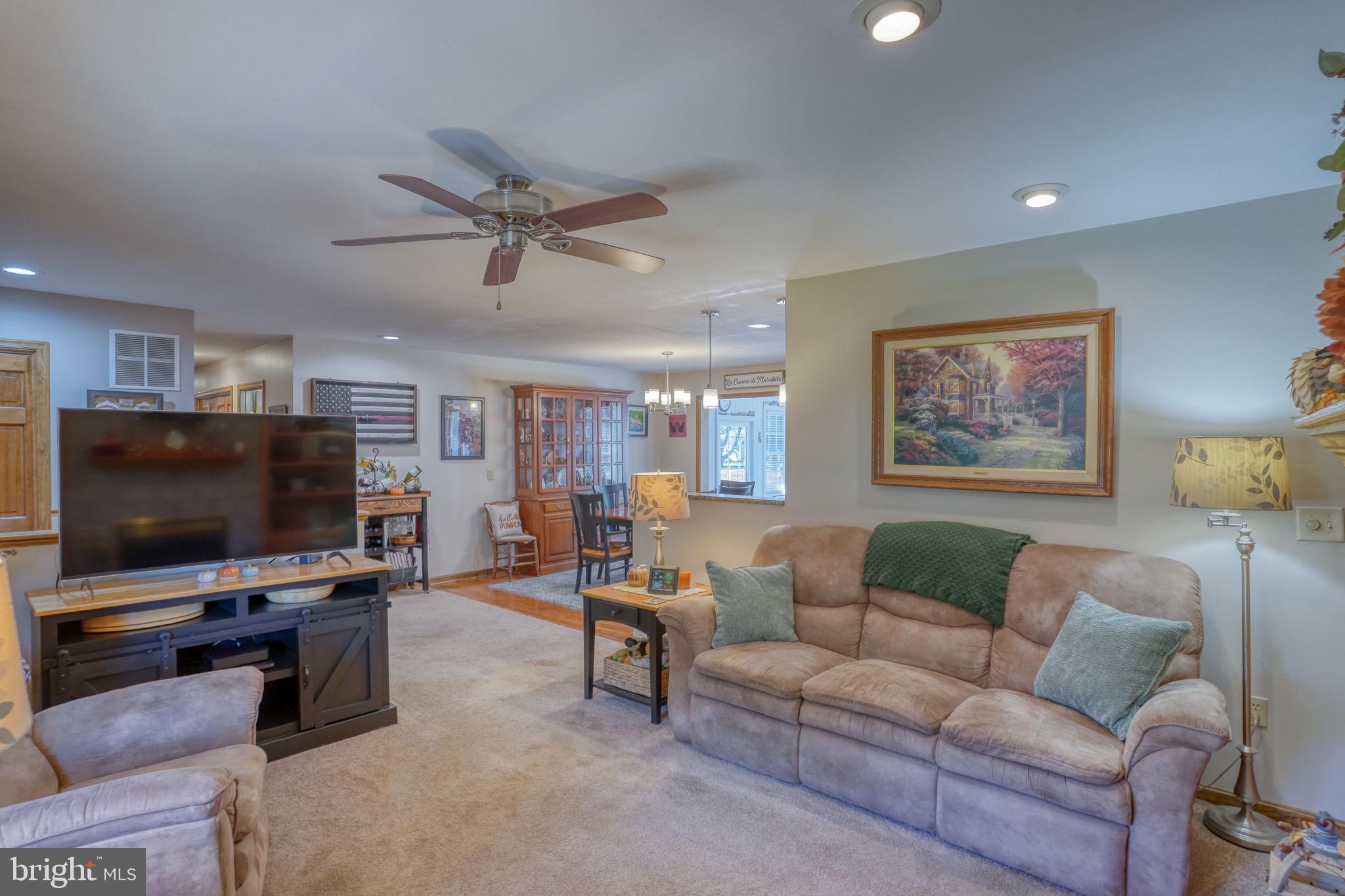 6420 Pearsons Corner Road Dover, DE 19904 - Photo 15 of 54 a living room with furniture and a flat screen tv