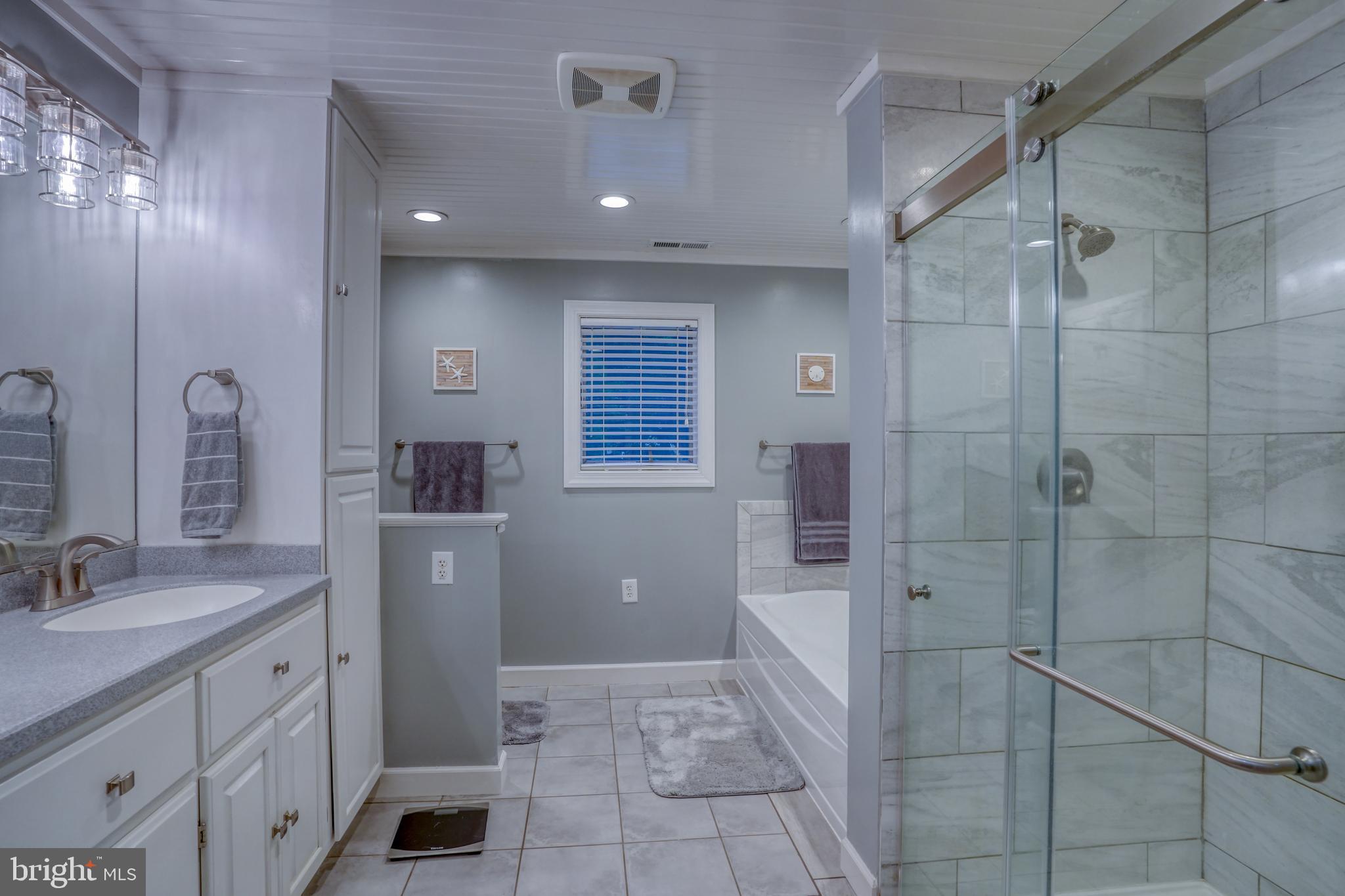 6420 Pearsons Corner Road Dover, DE 19904 - Photo 34 of 54 a bathroom with a sink a toilet and shower