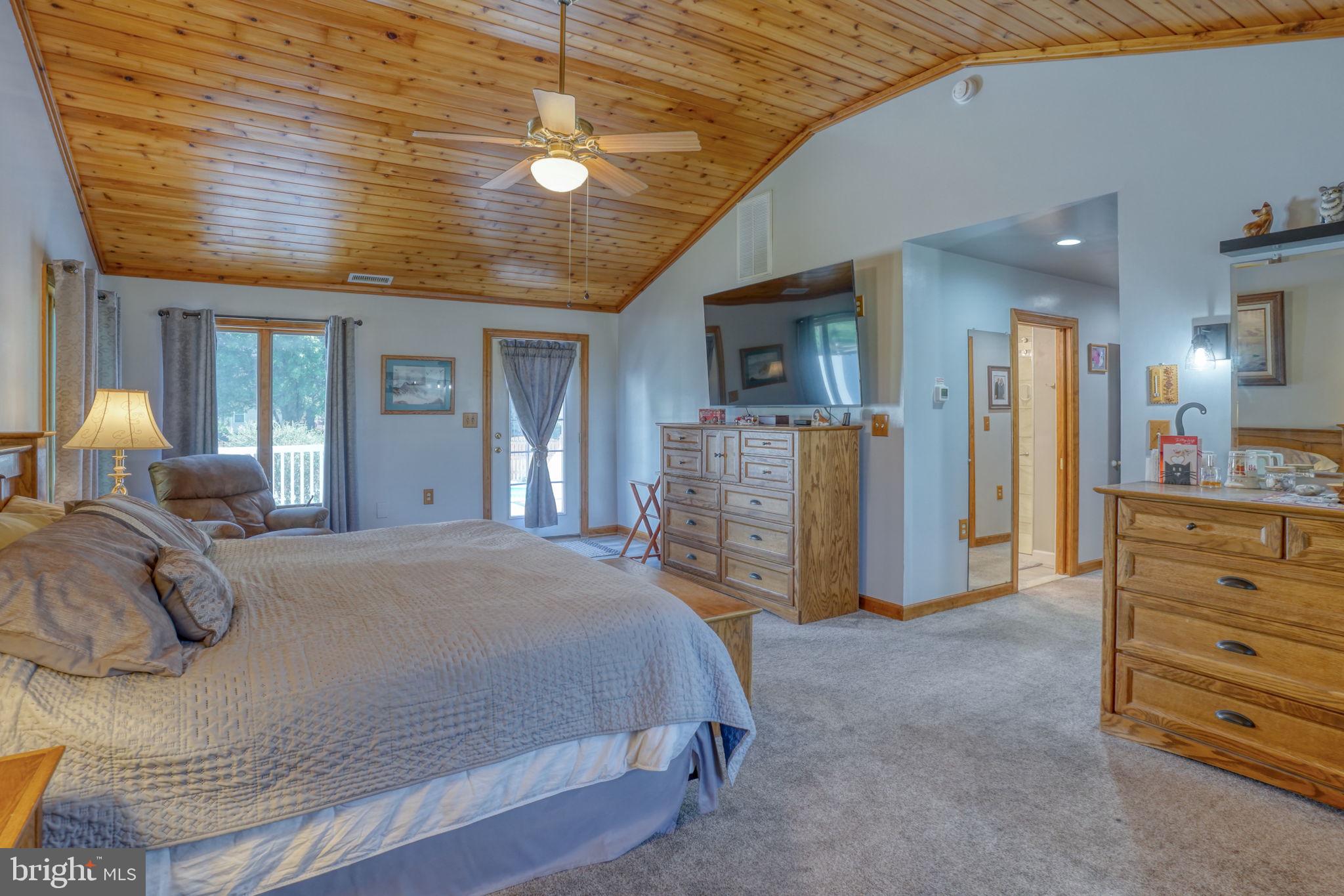 6420 Pearsons Corner Road Dover, DE 19904 - Photo 36 of 54 a bed room with a bed and furniture