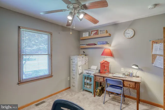 a view of a swimming pool with a yard