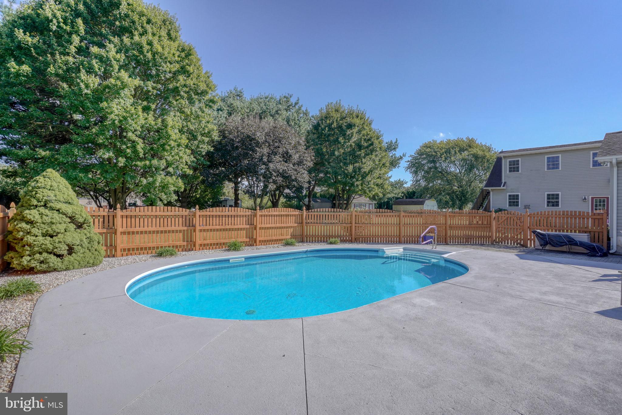 6420 Pearsons Corner Road Dover, DE 19904 - Photo 44 of 54 a view of a swimming pool with a yard