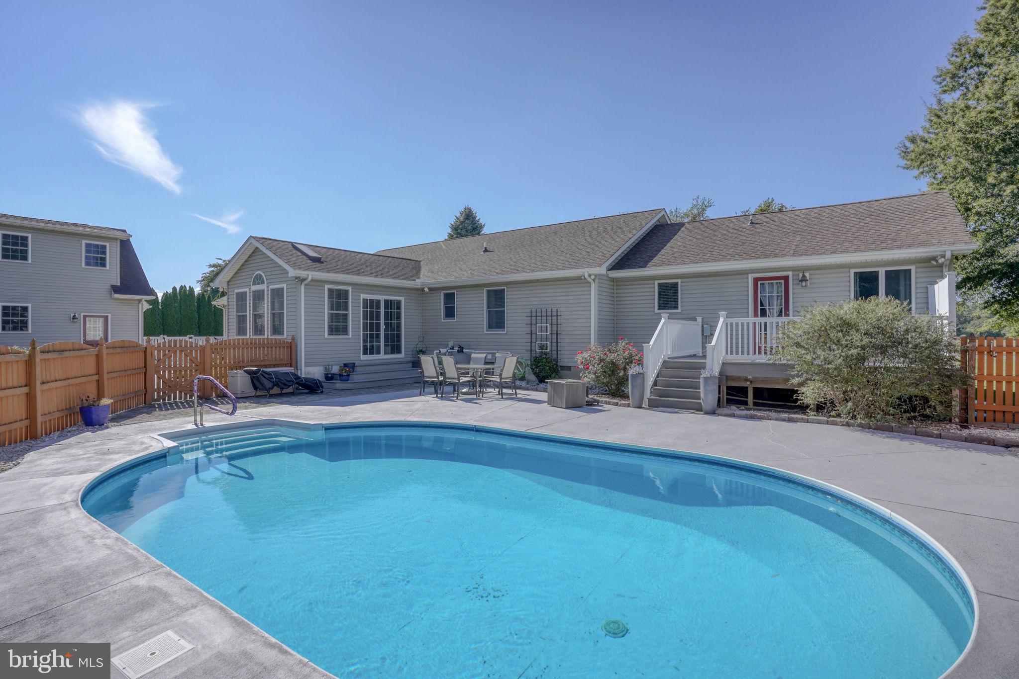6420 Pearsons Corner Road Dover, DE 19904 - Photo 45 of 54 a view of a house with swimming pool and a chairs